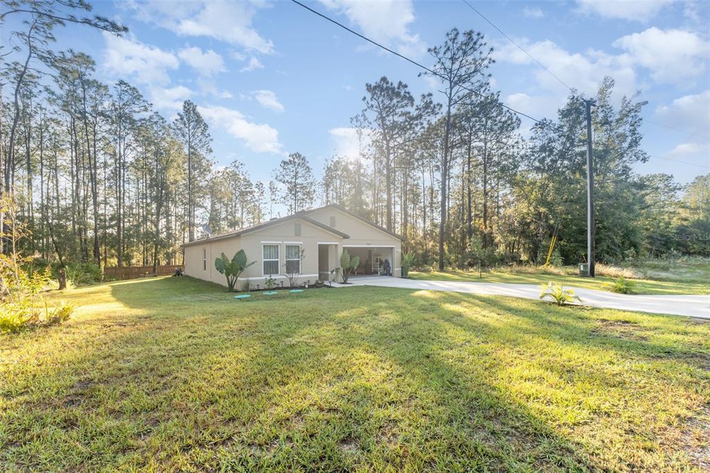 7065 North Heritage Drive Dunnellon, FL 34434 - Photo 2 of 30 a view of a house with a yard