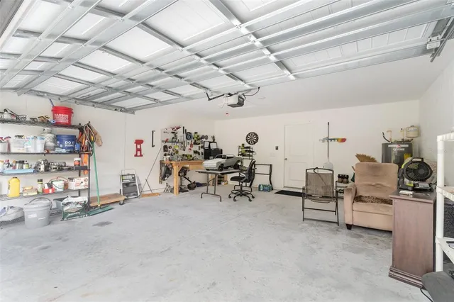 a view of a chairs and table on the wooden deck