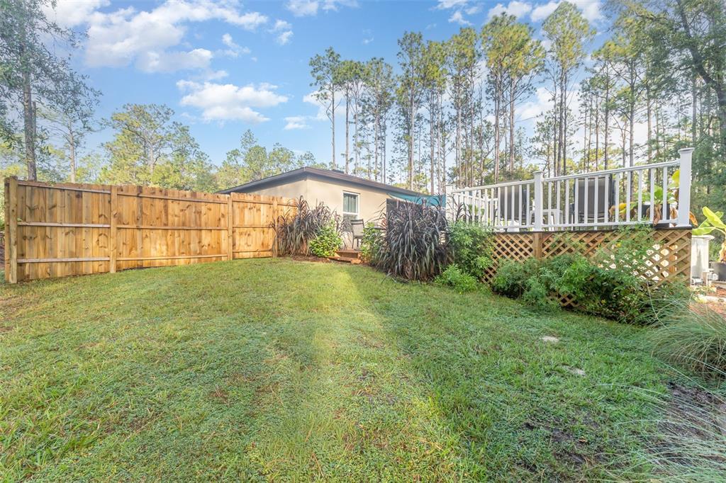 7065 North Heritage Drive Dunnellon, FL 34434 - Photo 29 of 30 a view of a backyard with plants and large trees