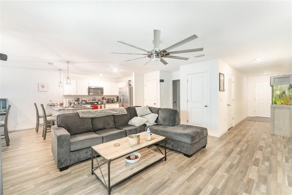 7065 North Heritage Drive Dunnellon, FL 34434 - Photo 4 of 30 a living room with furniture and a wooden floor