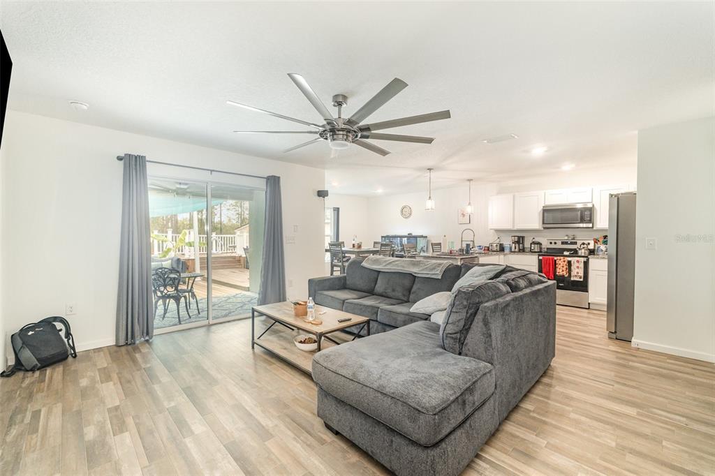 7065 North Heritage Drive Dunnellon, FL 34434 - Photo 5 of 30 a living room with furniture and a large window