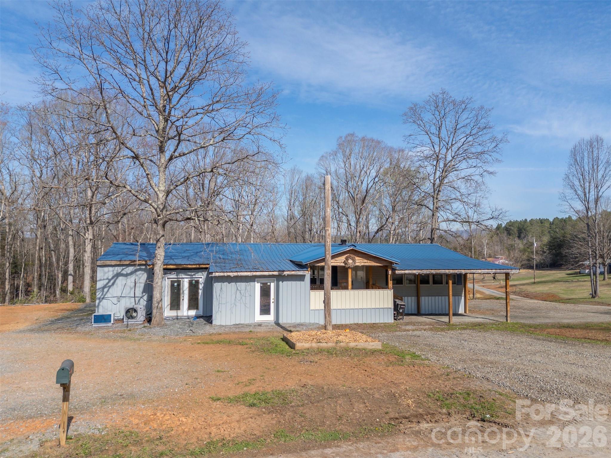 220 Mt Harmony Church Road Lawndale, NC 28090 - Photo 1 of 48 a front view of a house with a yard