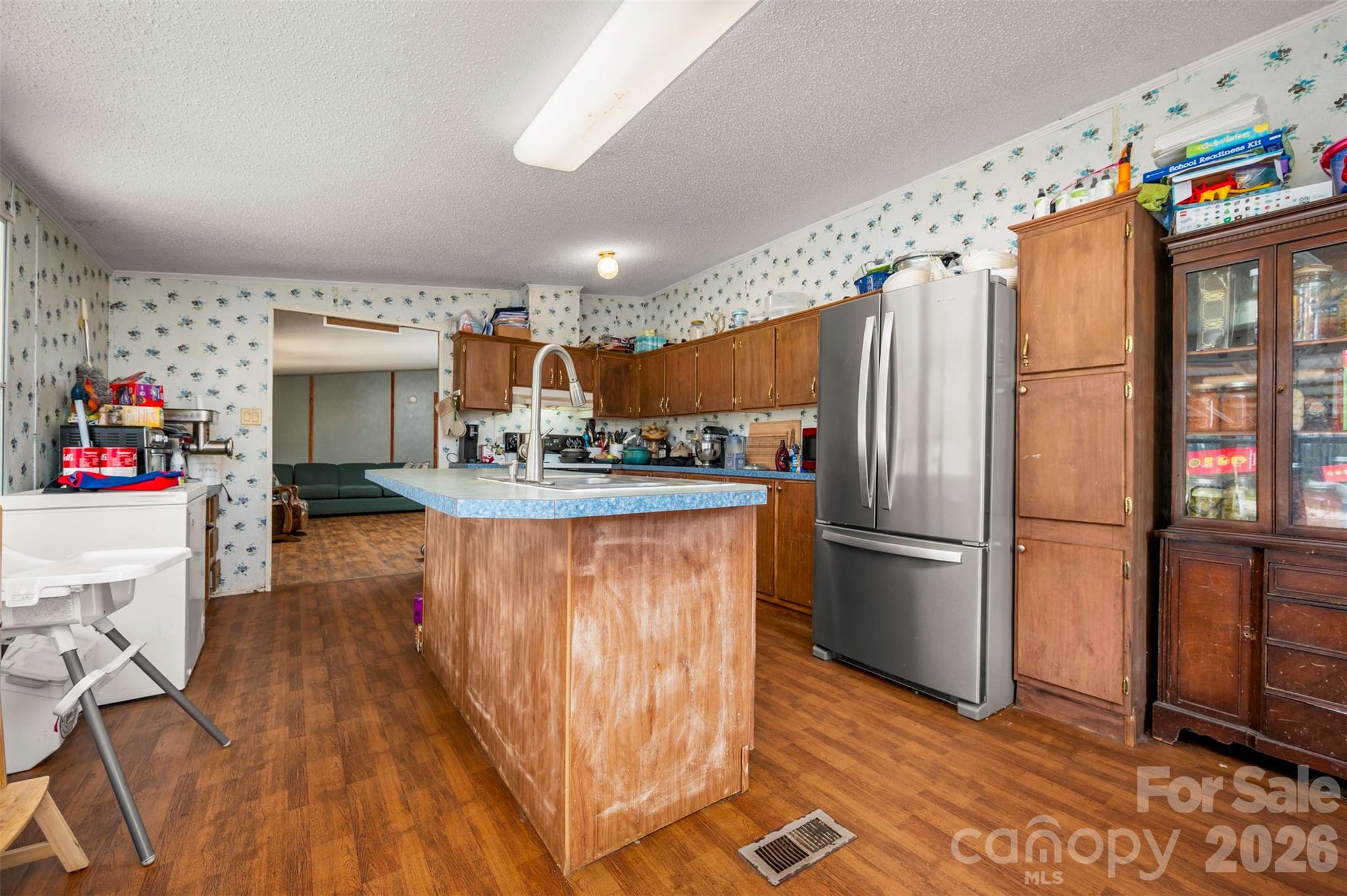 220 Mt Harmony Church Road Lawndale, NC 28090 - Photo 11 of 48 a kitchen with stainless steel appliances granite countertop a refrigerator and a sink