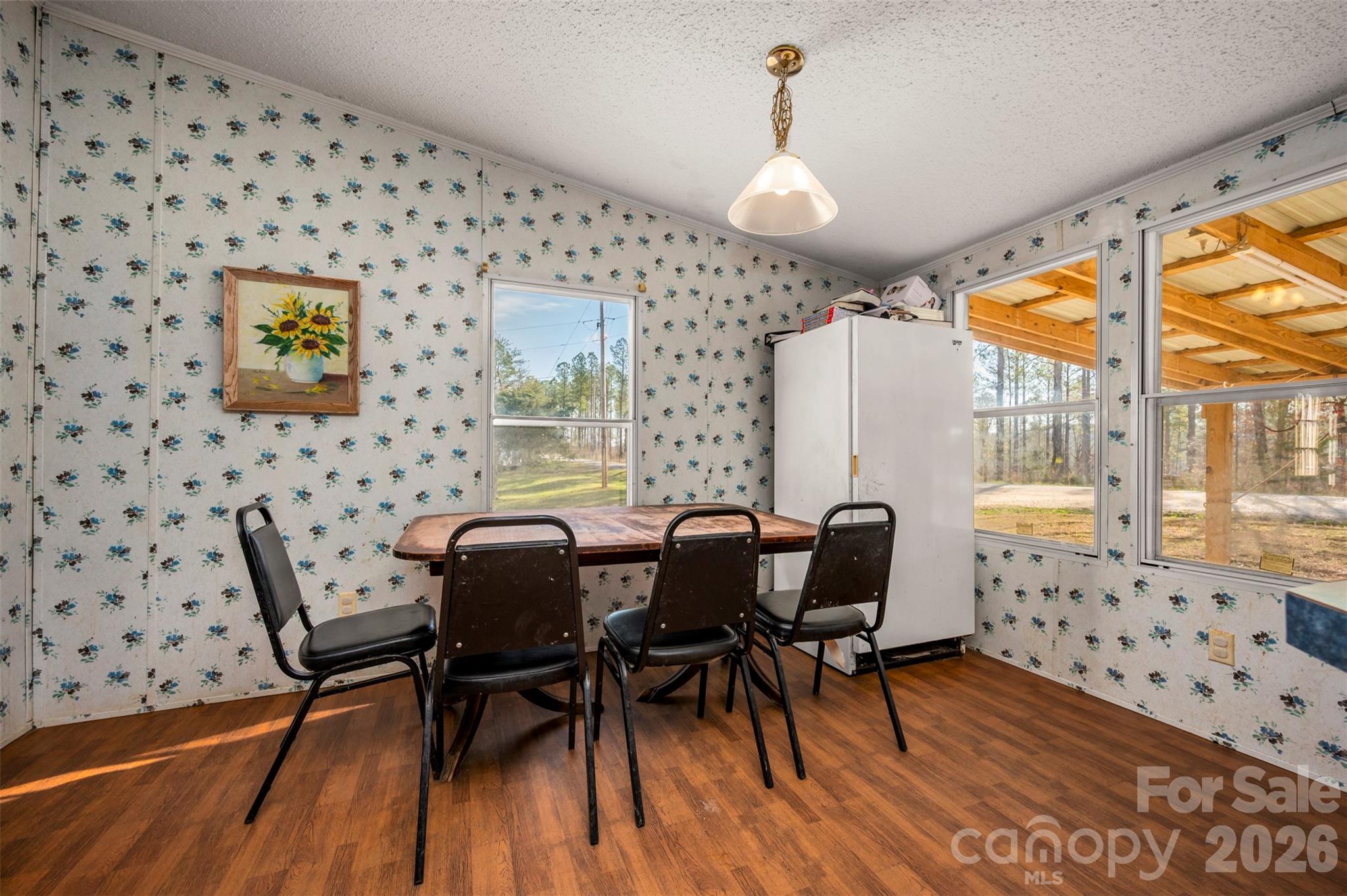 220 Mt Harmony Church Road Lawndale, NC 28090 - Photo 13 of 48 a dining room with furniture and wooden floor