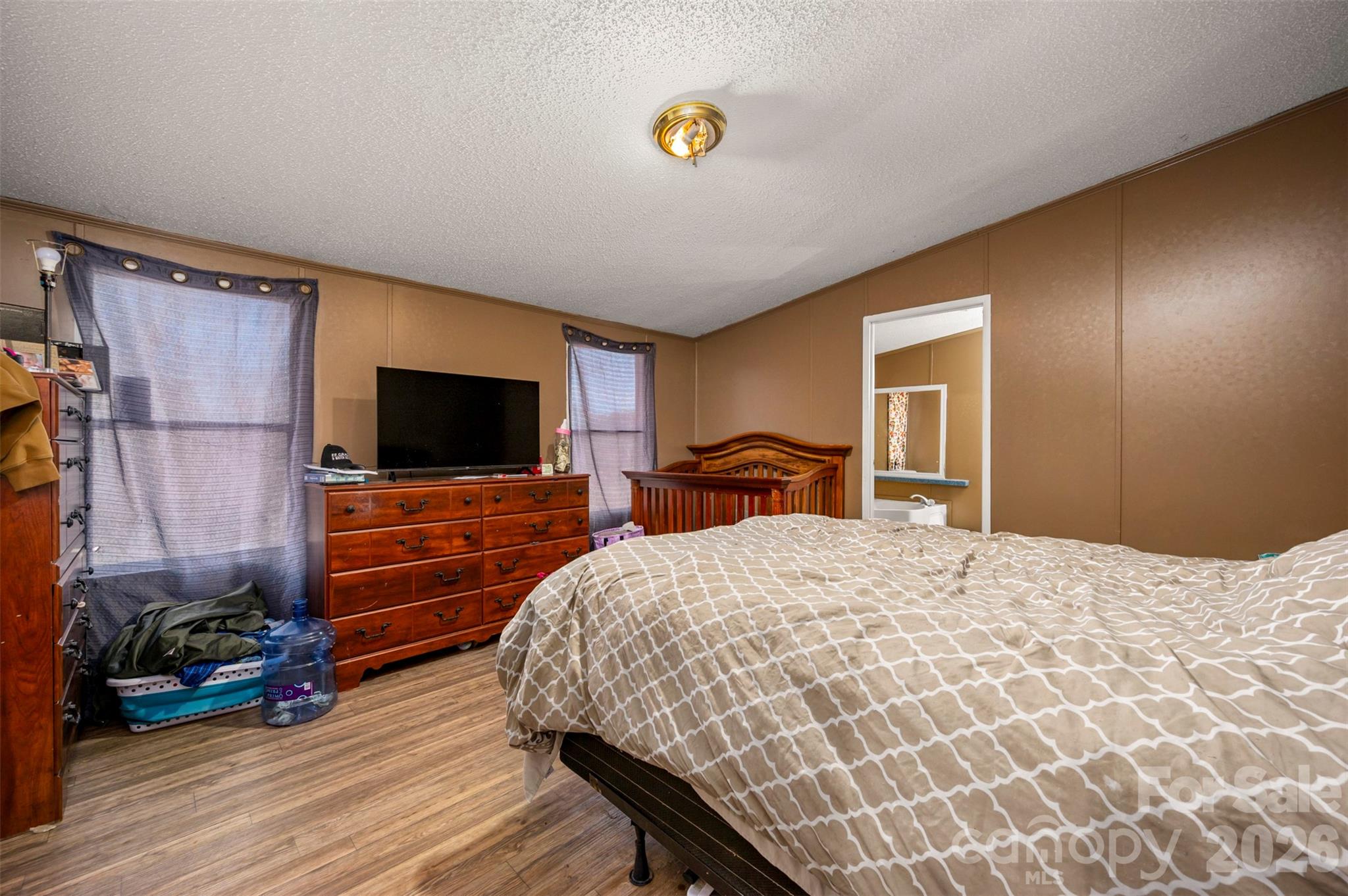 220 Mt Harmony Church Road Lawndale, NC 28090 - Photo 16 of 48 a bedroom with a bed and a flat screen tv