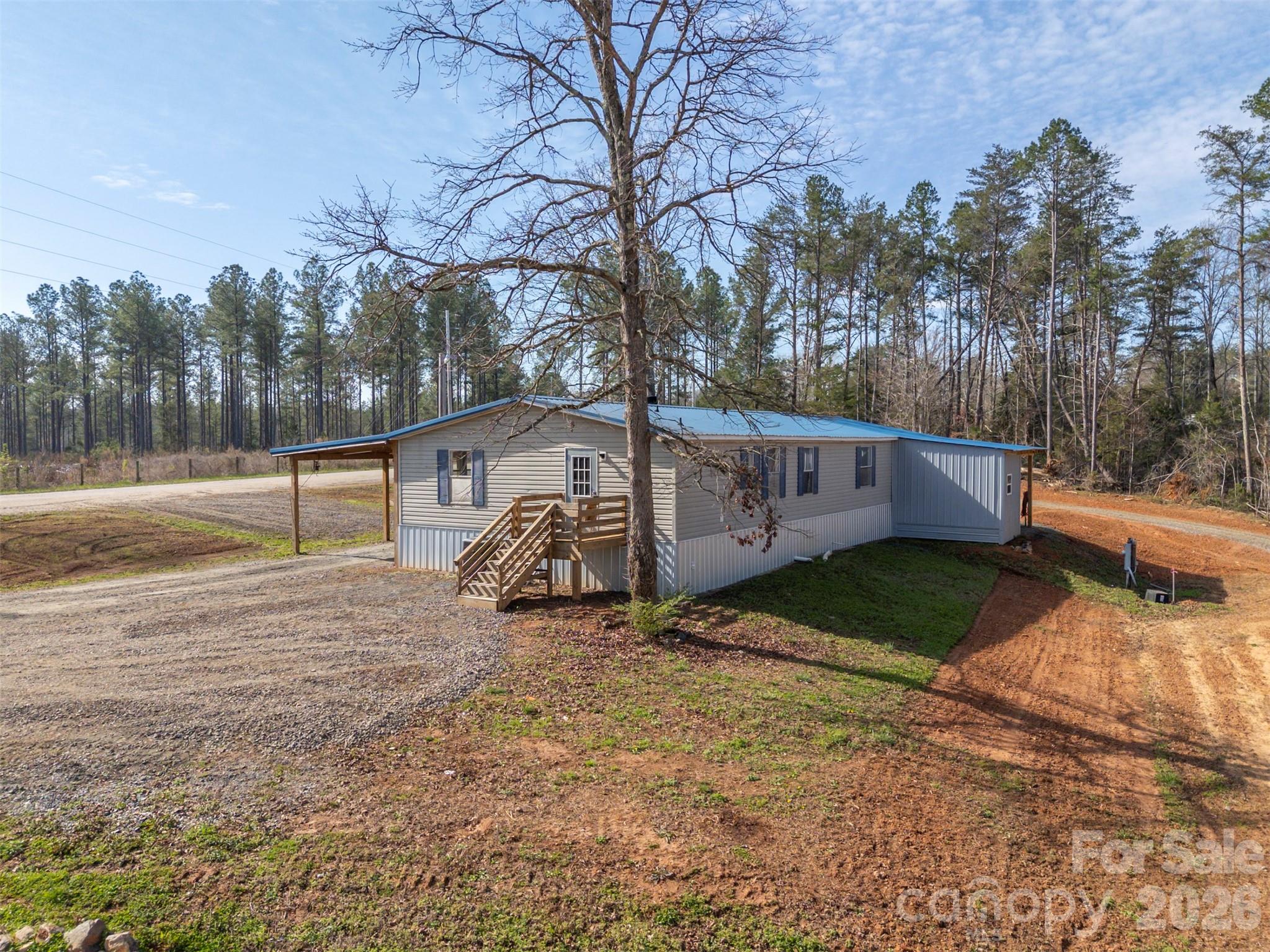 220 Mt Harmony Church Road Lawndale, NC 28090 - Photo 2 of 48 a view of a street with some trees