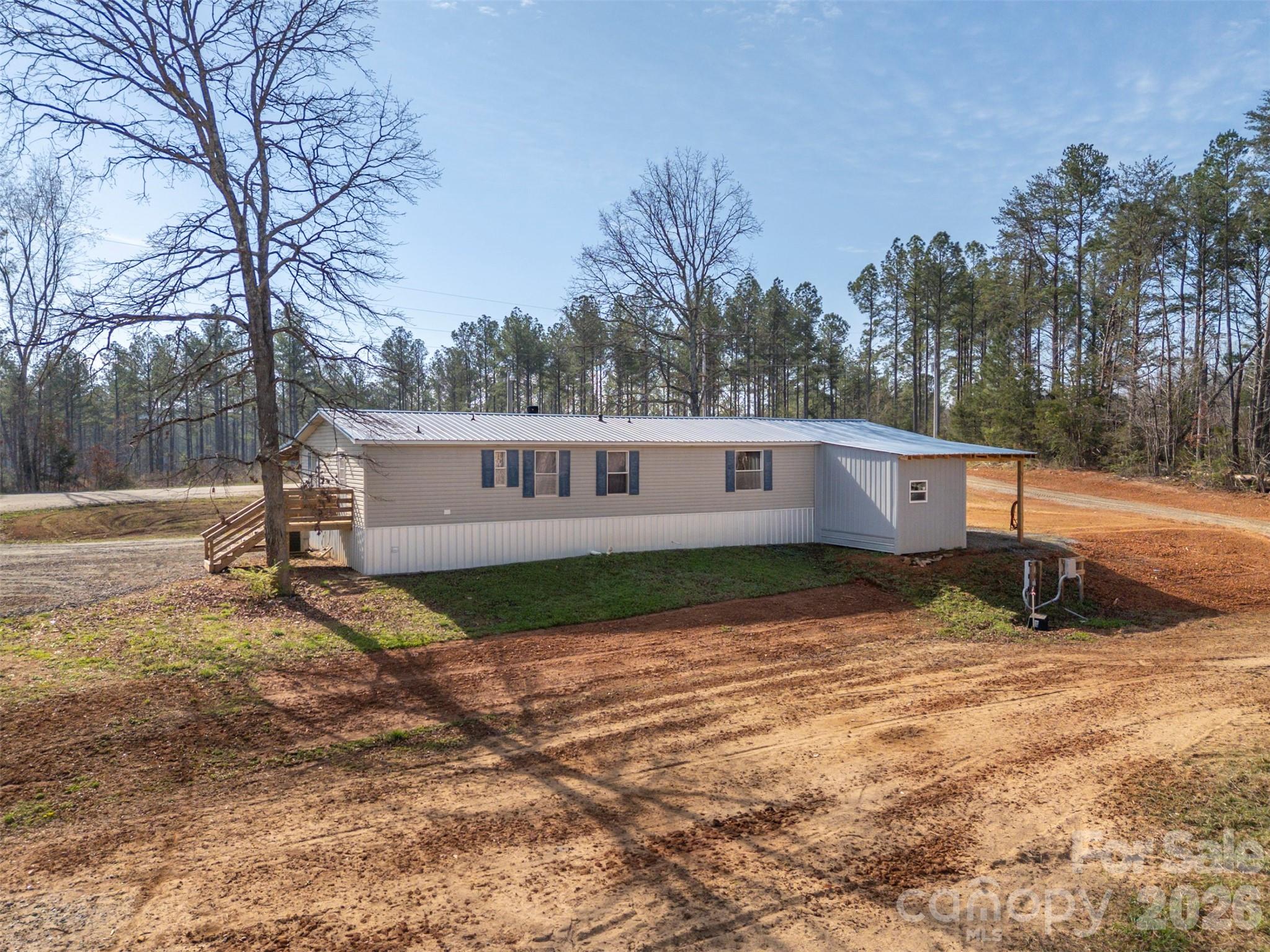 220 Mt Harmony Church Road Lawndale, NC 28090 - Photo 33 of 48 a view of a house with a yard