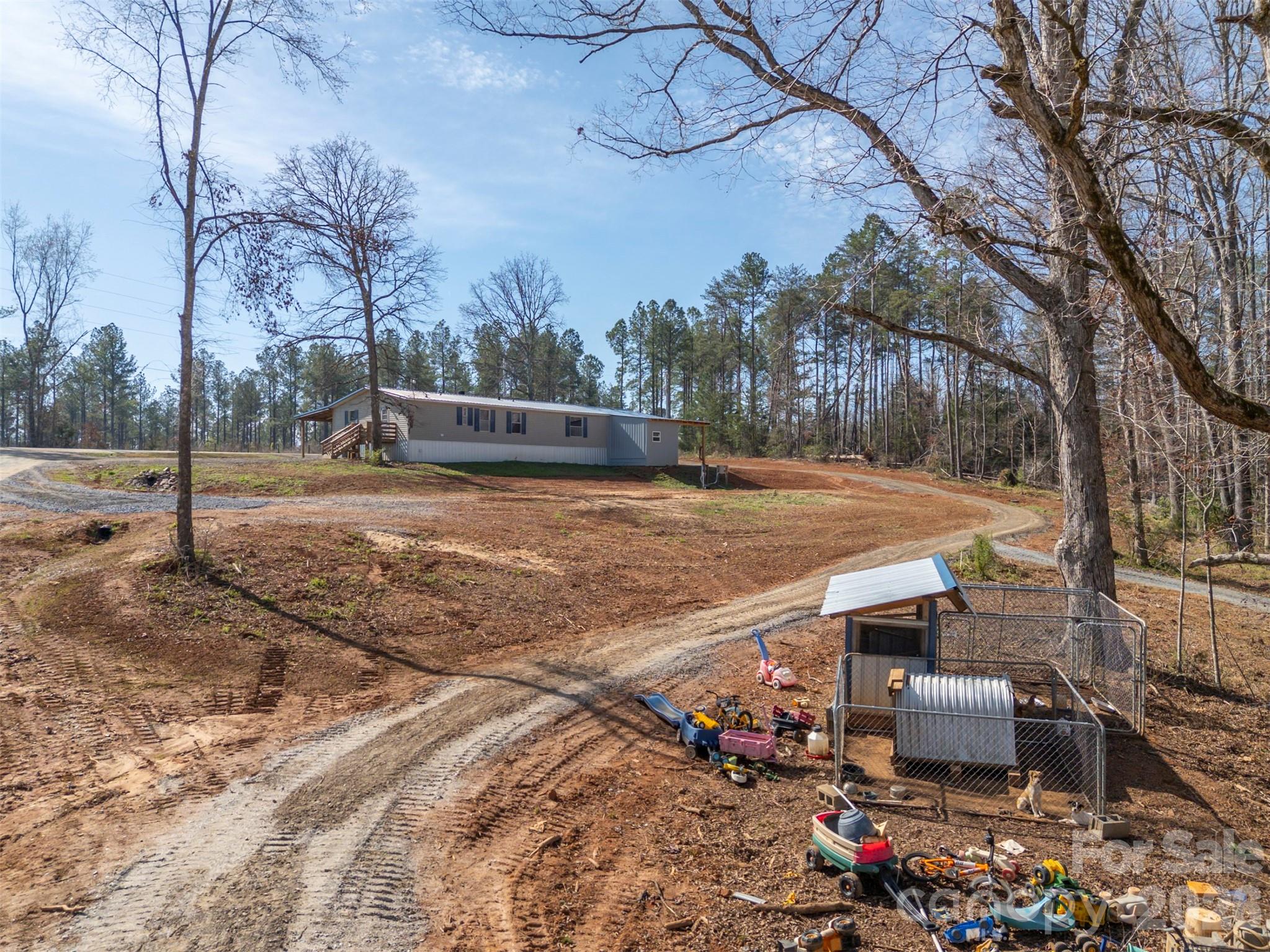 220 Mt Harmony Church Road Lawndale, NC 28090 - Photo 35 of 48 a view of a patio with furniture and trees