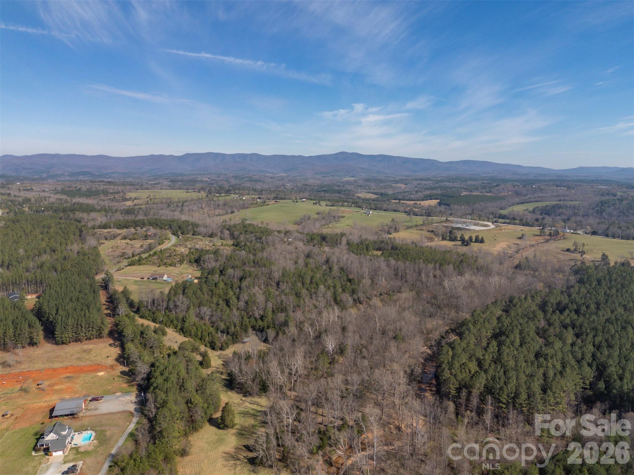 220 Mt Harmony Church Road Lawndale, NC 28090 - Photo 45 of 48 a view of a lake with mountains in the background