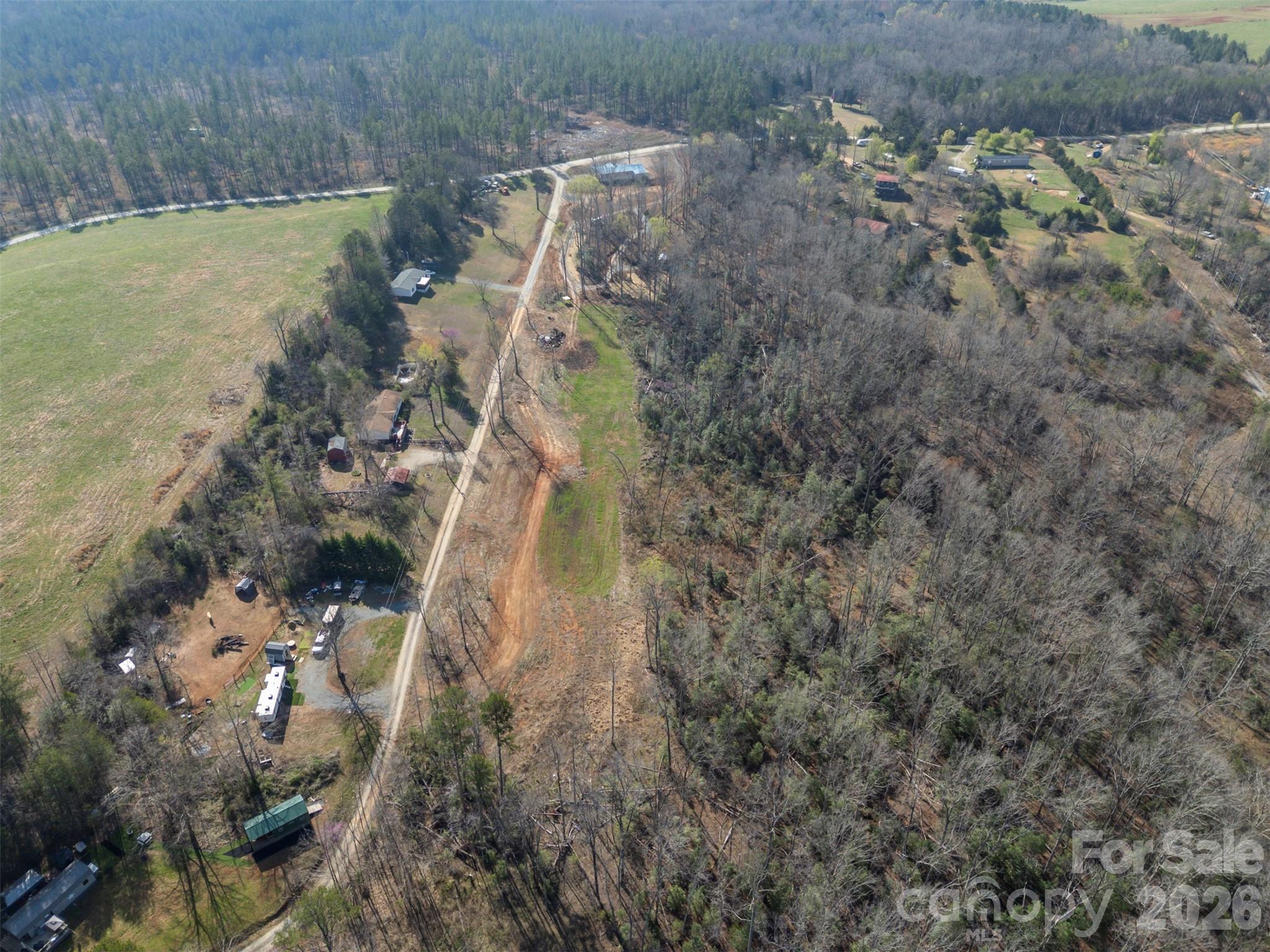 220 Mt Harmony Church Road Lawndale, NC 28090 - Photo 47 of 48 a aerial view of a house with a yard and large trees