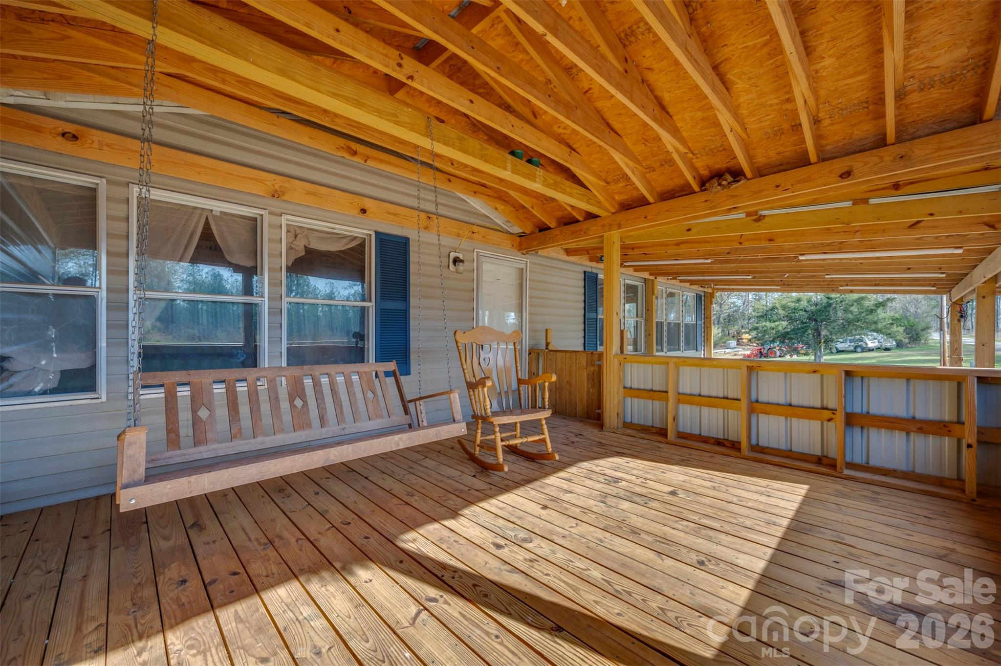 220 Mt Harmony Church Road Lawndale, NC 28090 - Photo 6 of 48 a balcony with wooden floor