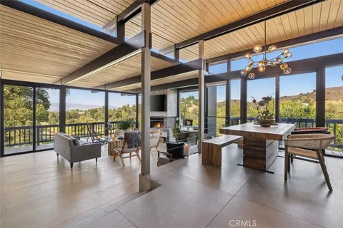 a kitchen with stove and cabinets