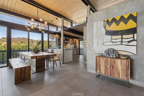 a kitchen with sink and cabinets