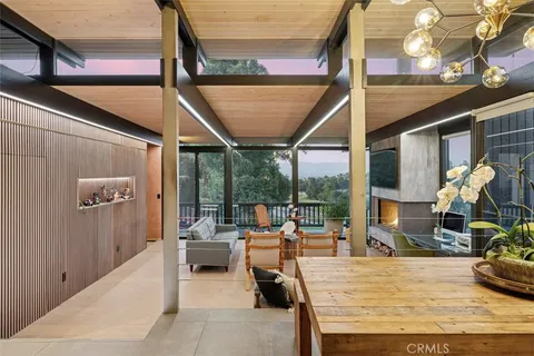 a large kitchen with stainless steel appliances granite countertop a stove a sink and cabinets