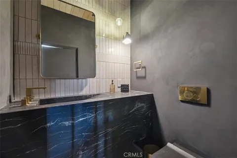 a view of a patio with a dining table and chairs