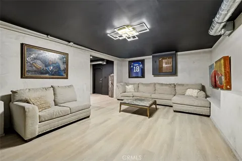 a view of a patio with table and chairs with wooden floor and fence
