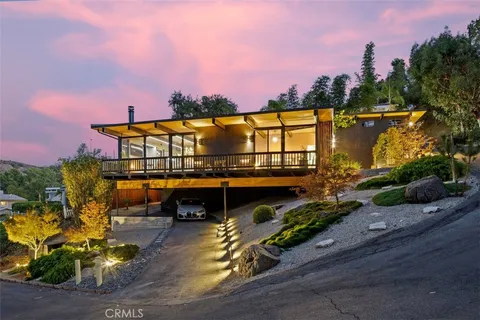 a room with water heater and wooden floor