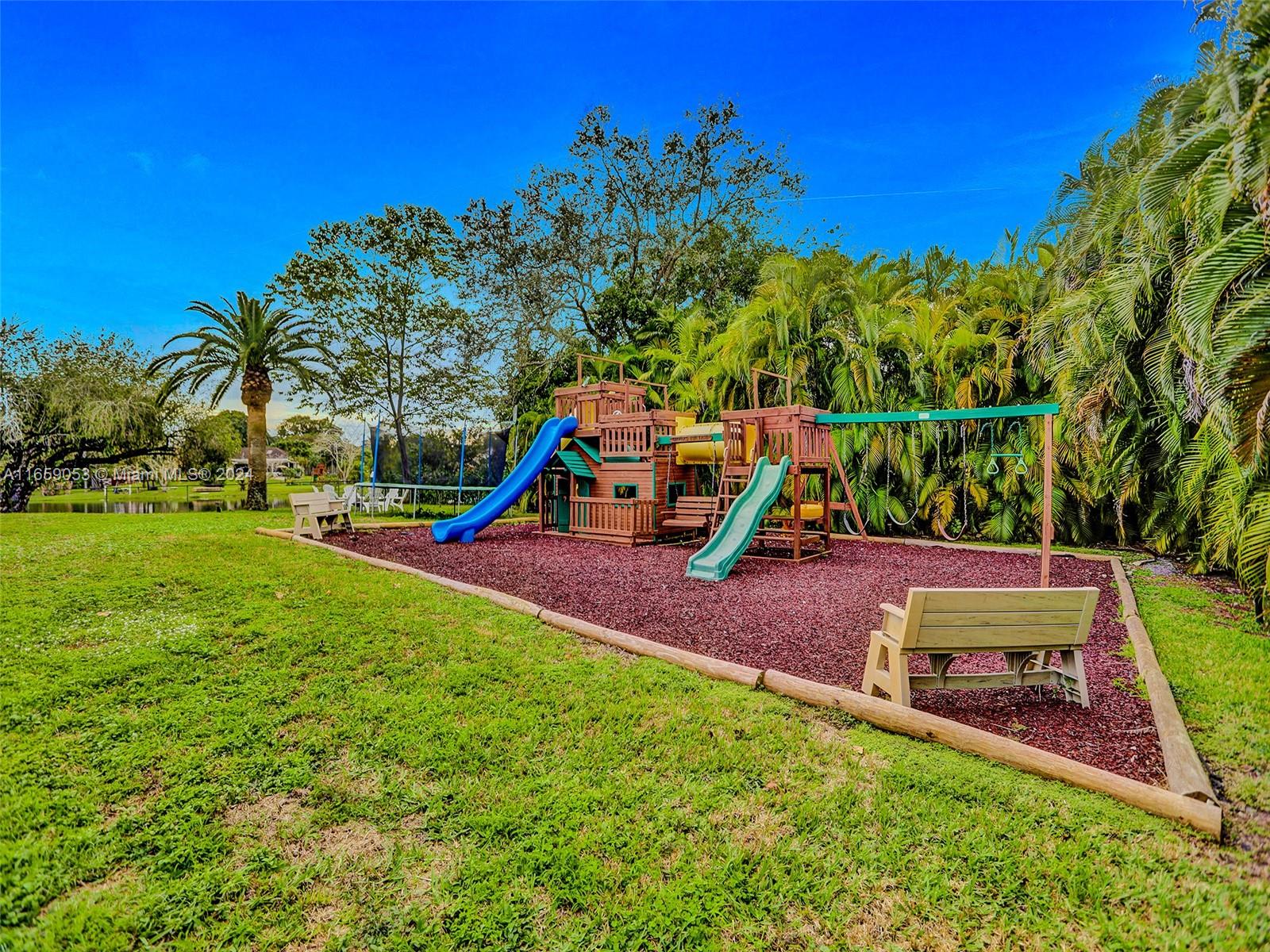 20221 Southwest 48th Place Southwest Ranches, FL 33332 - Photo 21 of 42 a view of a park with swings
