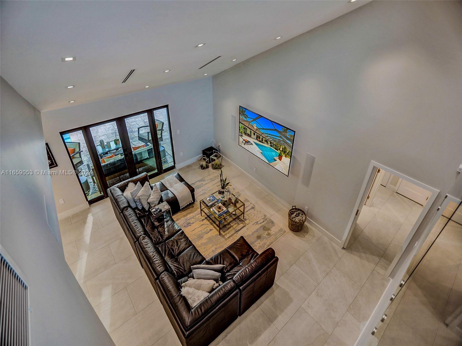 20221 Southwest 48th Place Southwest Ranches, FL 33332 - Photo 24 of 42 a living room with furniture and a window