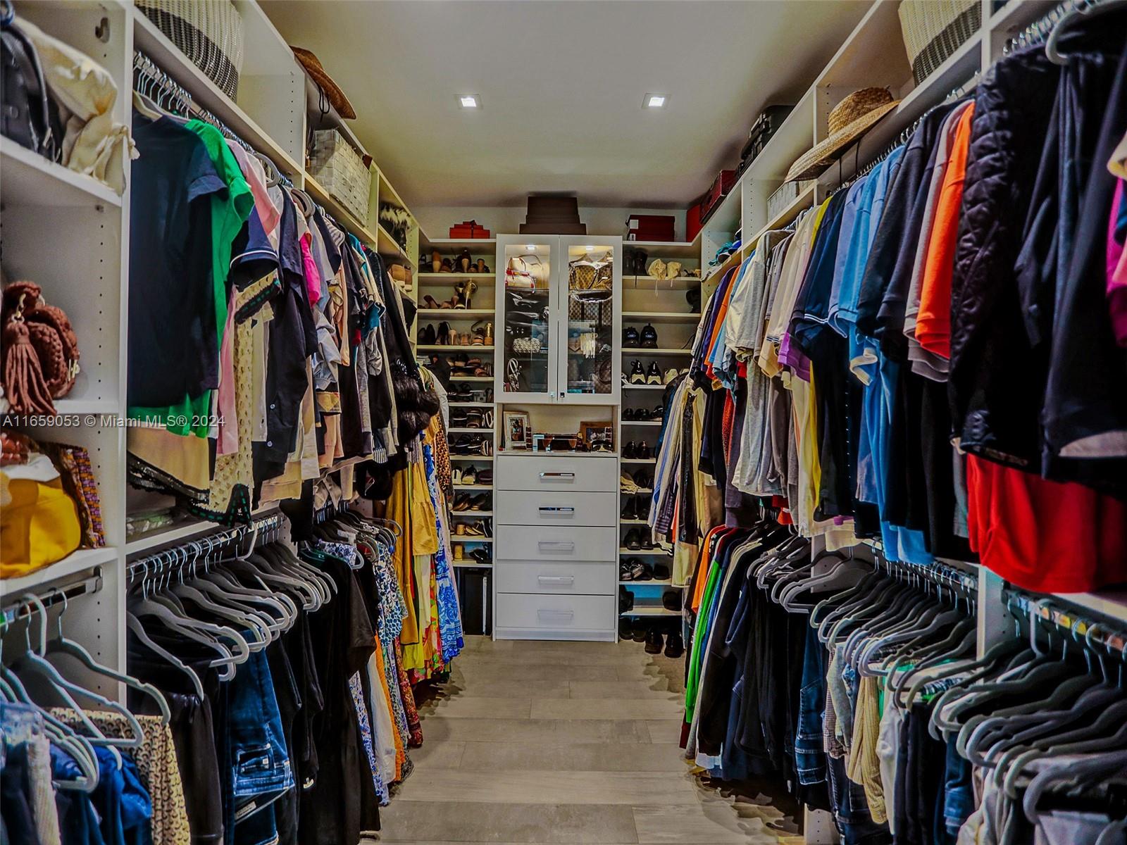 20221 Southwest 48th Place Southwest Ranches, FL 33332 - Photo 29 of 42 a view of walk in closet with clothes and shoes