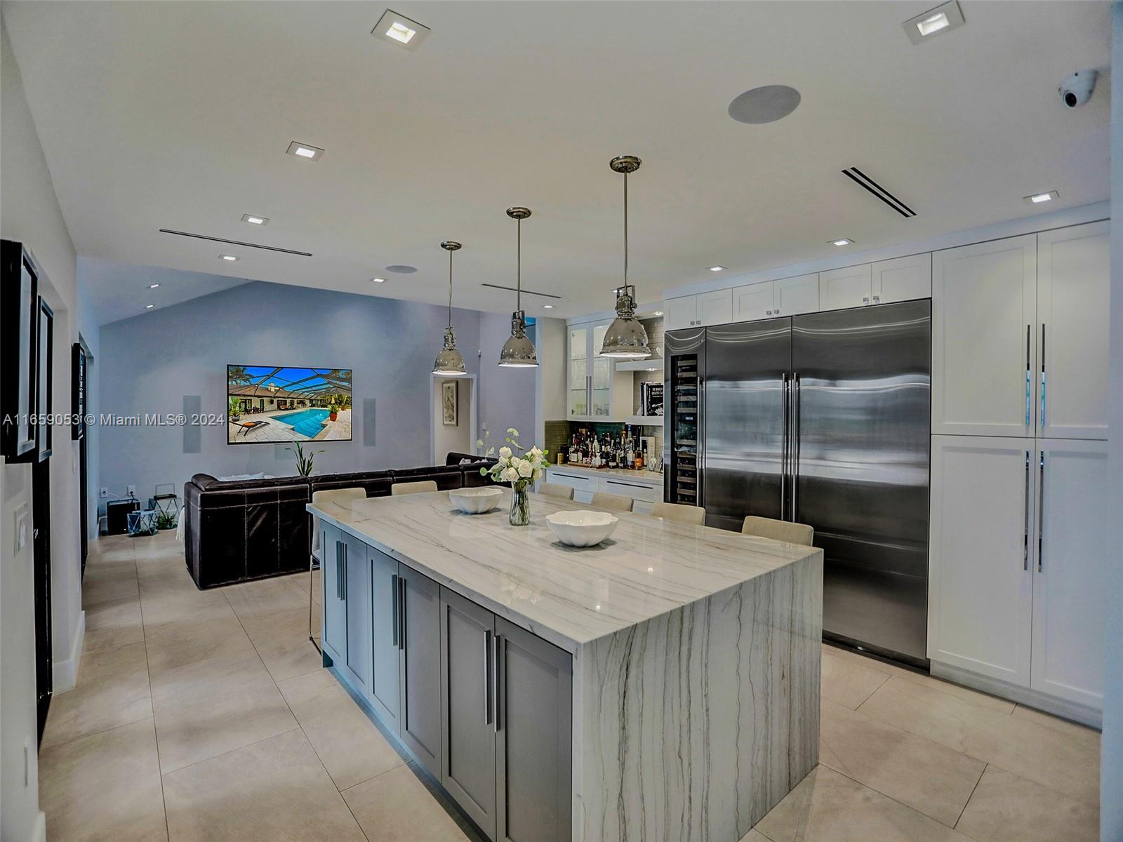 20221 Southwest 48th Place Southwest Ranches, FL 33332 - Photo 8 of 42 a kitchen with a stove a refrigerator and a sink