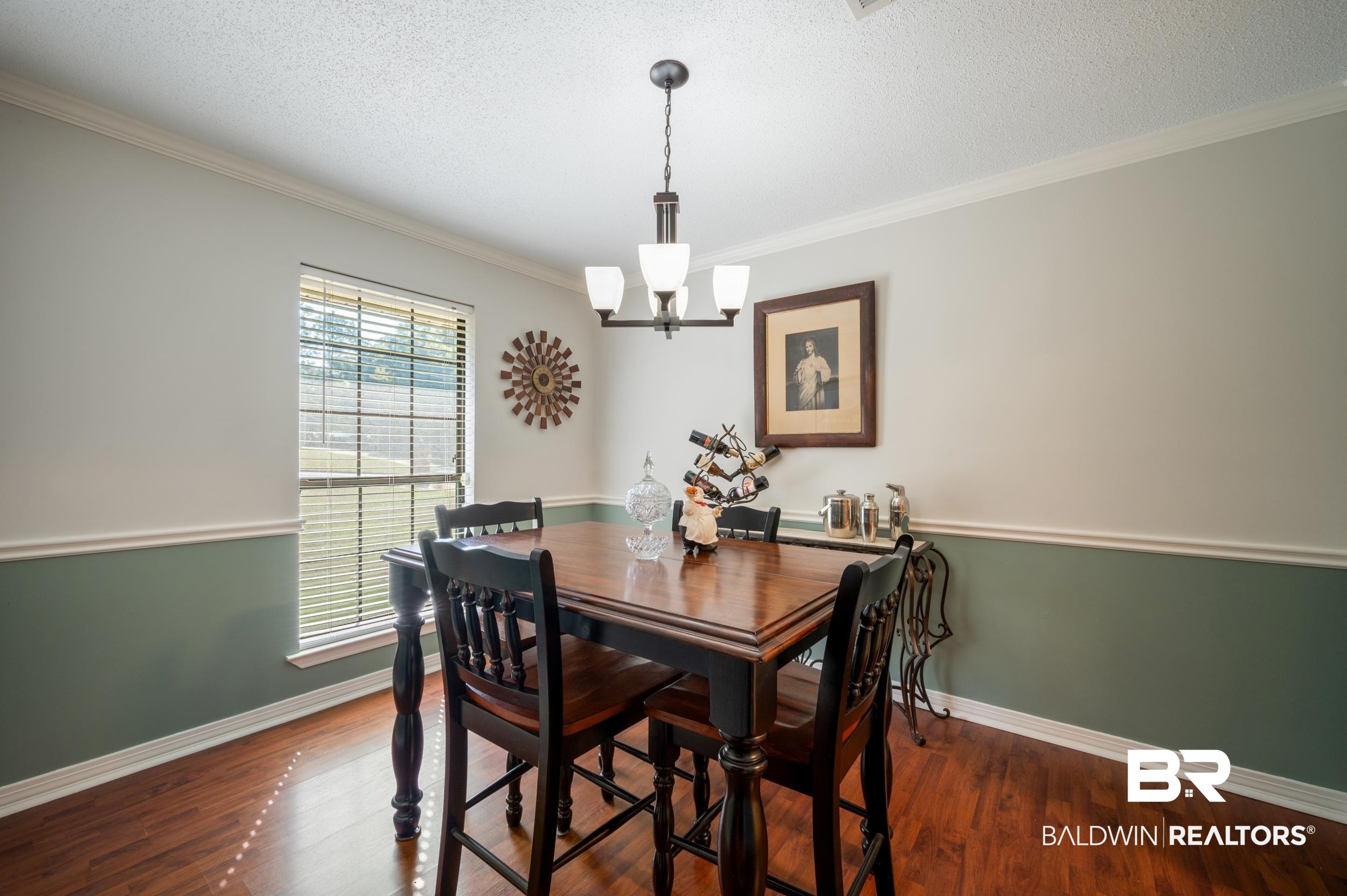 550 Norwood Road Monroeville, AL 36460 - Photo 11 of 46 Dining space with a textured ceiling, ornamental molding, dark wood-style flooring, and a chandelier