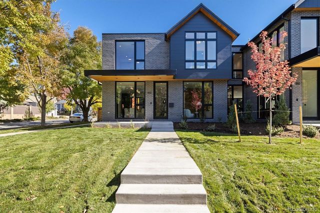 a porch with a table and chairs