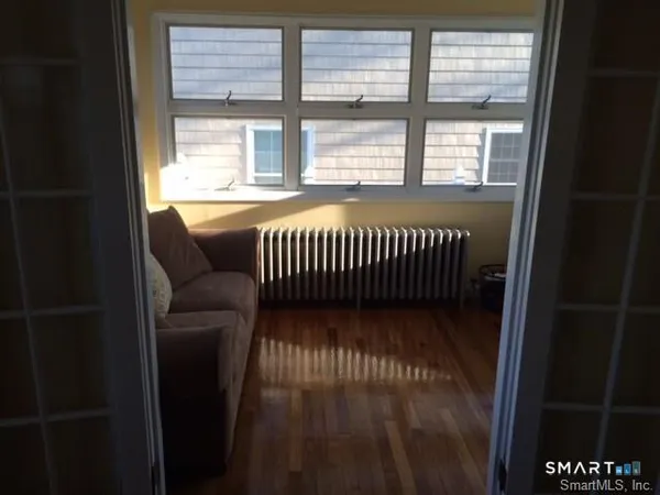 a view of balcony with wooden floor