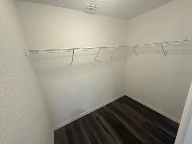 a view of a room with racks on the wall