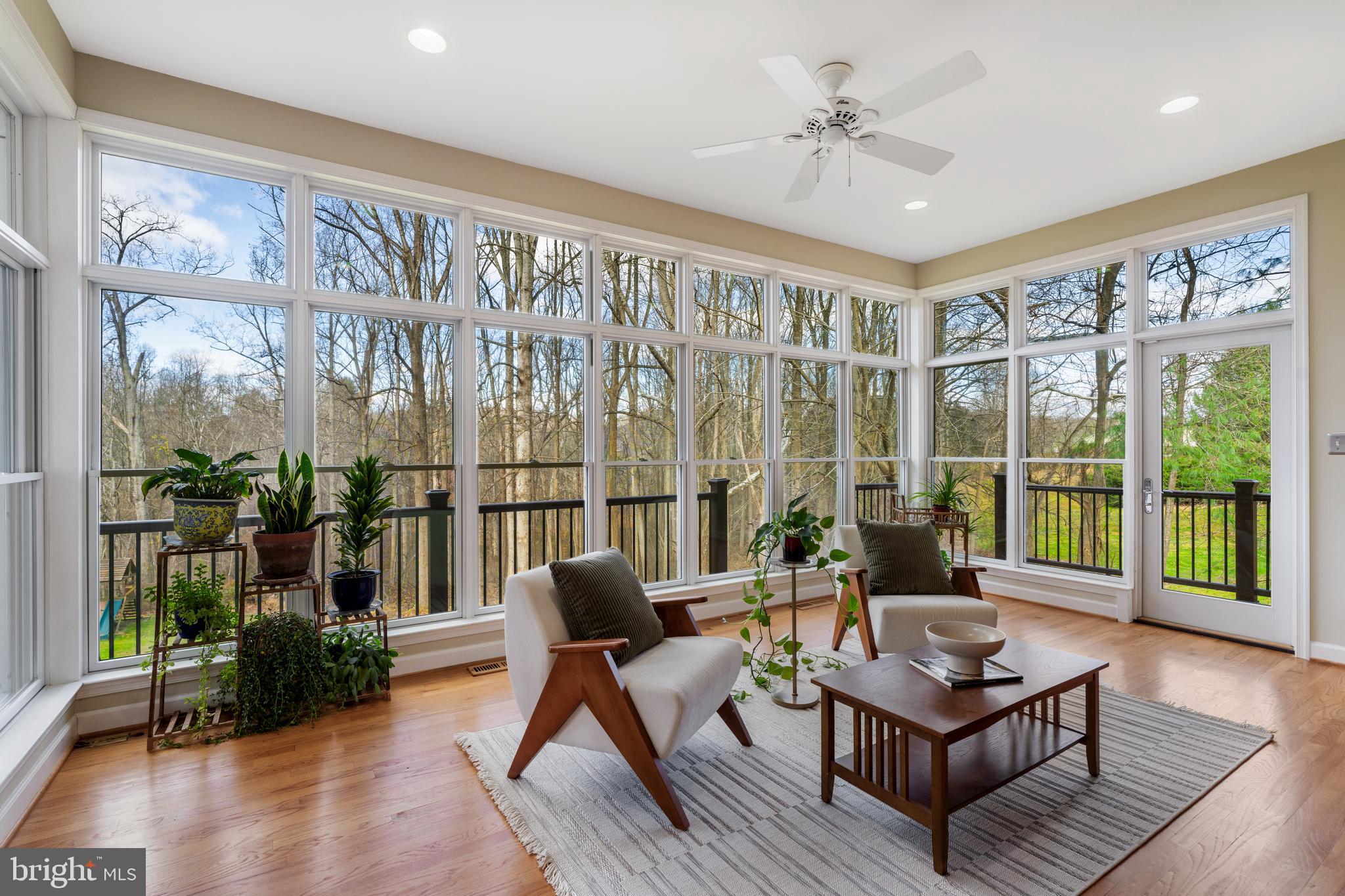 10 7 Springs Court Phoenix, MD 21131 - Photo 14 of 64 a living room with furniture and a large window with wooden floor