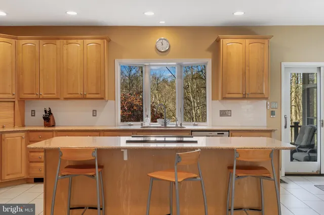a view of a dining room with furniture wooden floor and chandelier