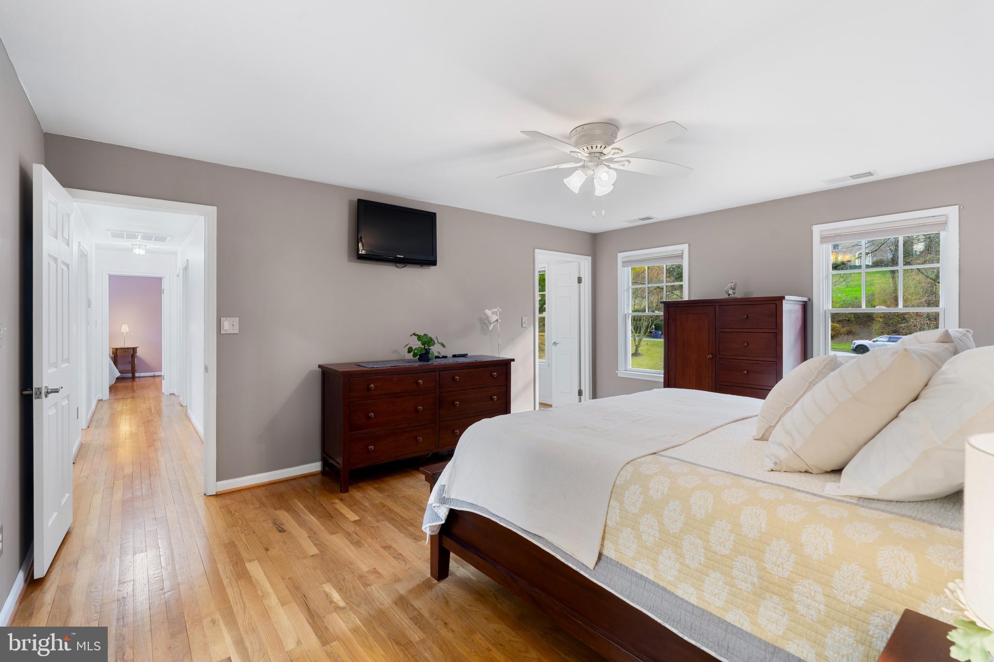 10 7 Springs Court Phoenix, MD 21131 - Photo 25 of 64 a bedroom with a bed and a flat screen tv