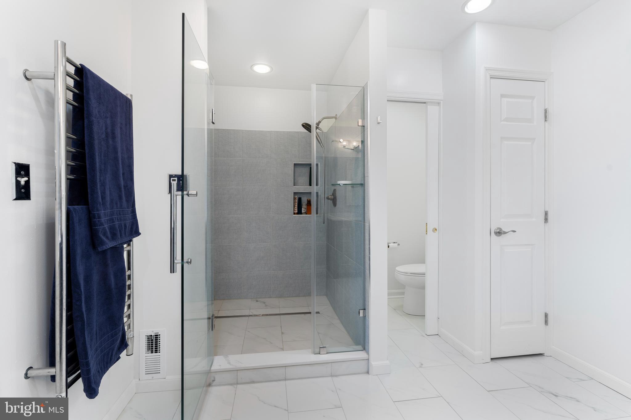 10 7 Springs Court Phoenix, MD 21131 - Photo 28 of 64 a bathroom with a shower and a glass door