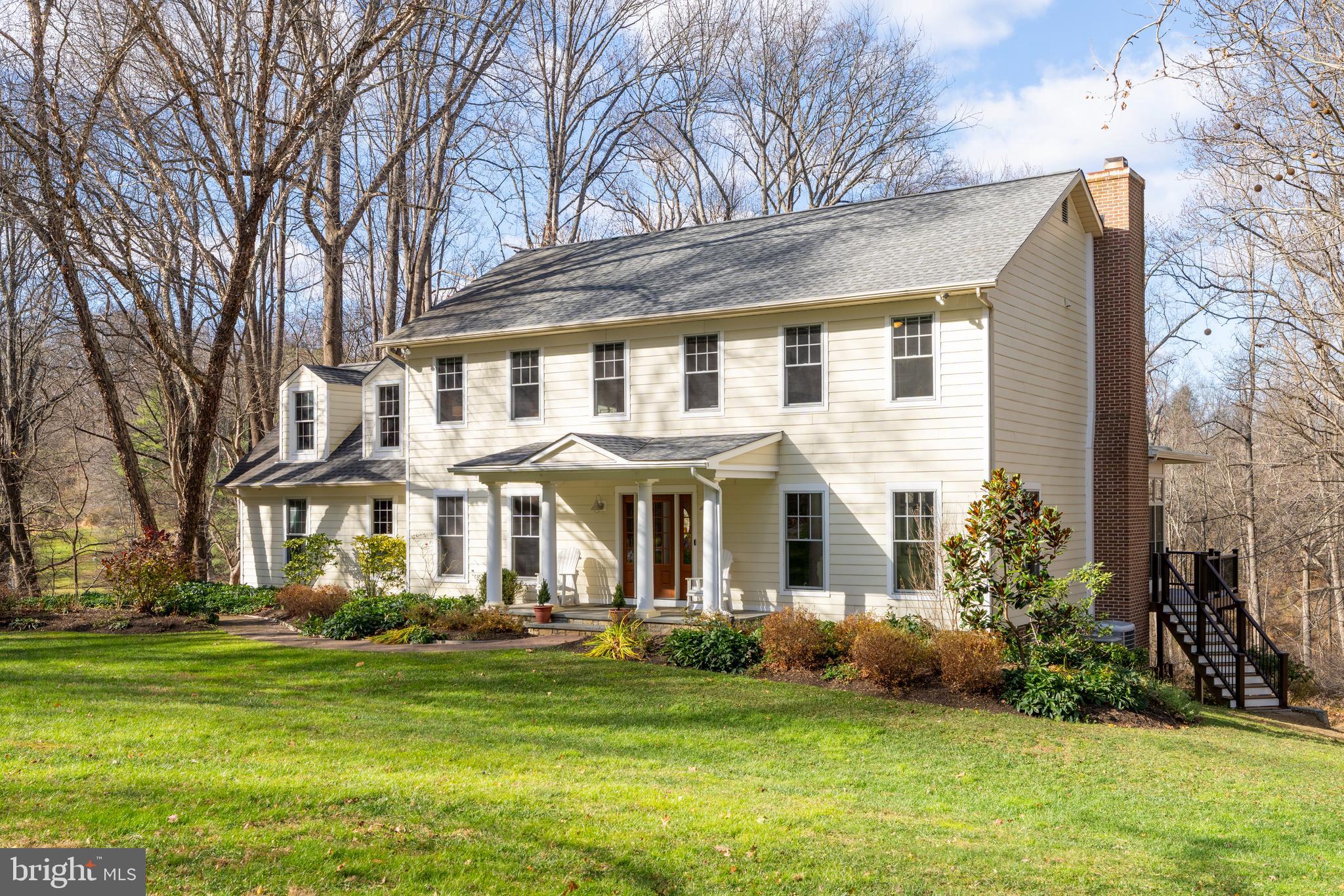 10 7 Springs Court Phoenix, MD 21131 - Photo 3 of 64 a front view of a house with a garden
