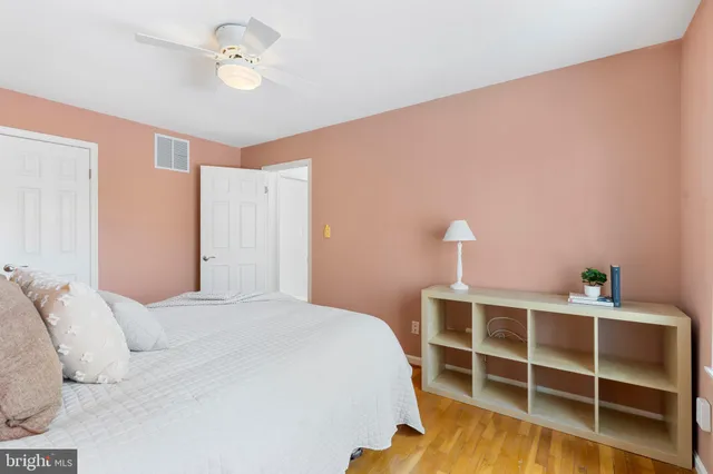 a bedroom with a bed and a closet