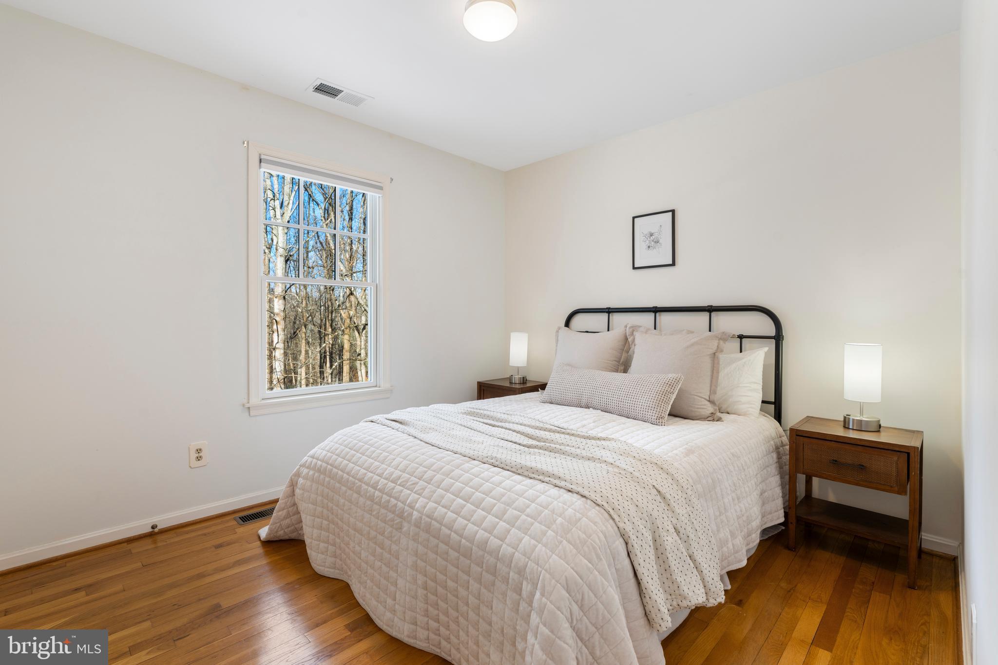 10 7 Springs Court Phoenix, MD 21131 - Photo 36 of 64 a bedroom with a bed and wooden floor