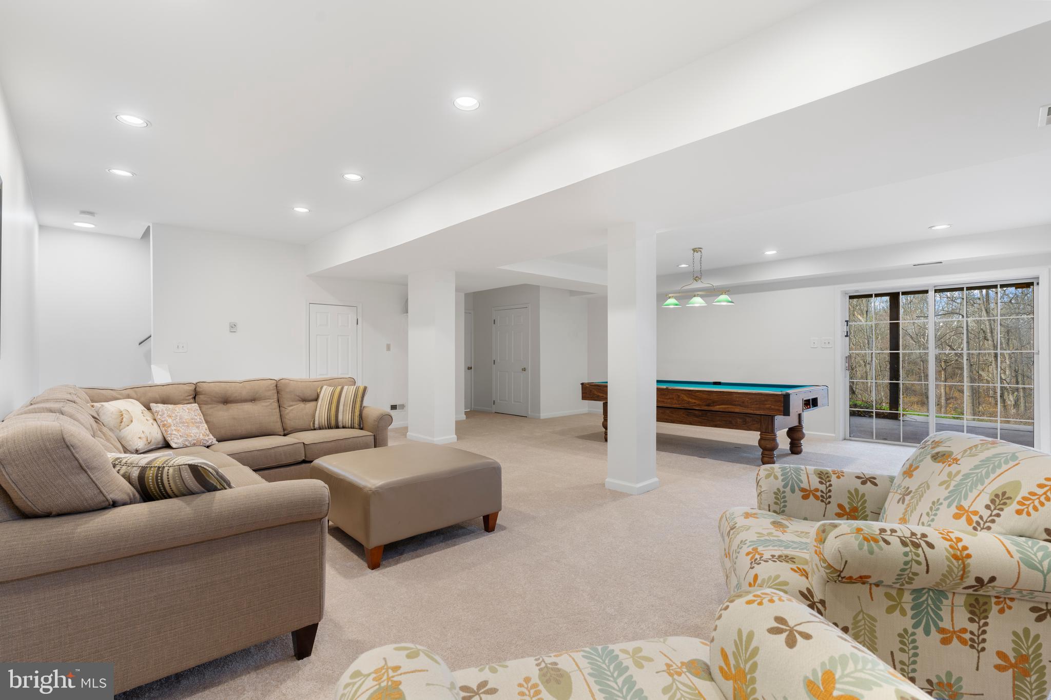 10 7 Springs Court Phoenix, MD 21131 - Photo 38 of 64 a living room with furniture and a large window