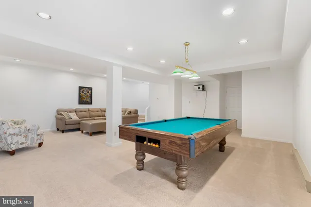 a building outdoor space with patio furniture and potted plants