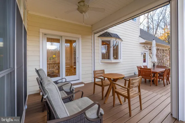 a aerial view of a house with a yard table and chairs