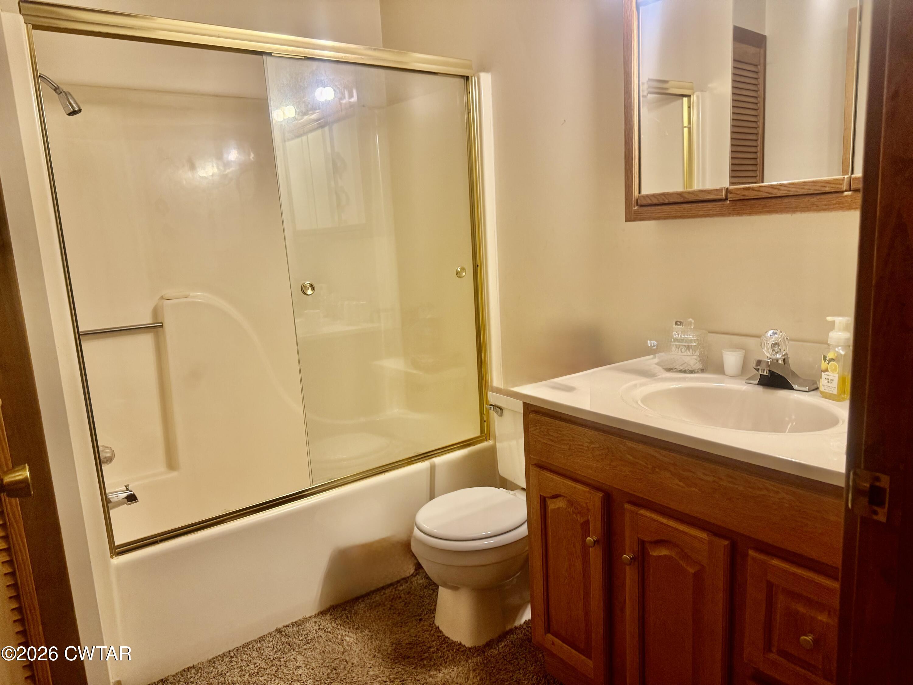 5082 Claude Tucker Road Union City, TN 38261 - Photo 12 of 20 a bathroom with a sink a toilet and shower
