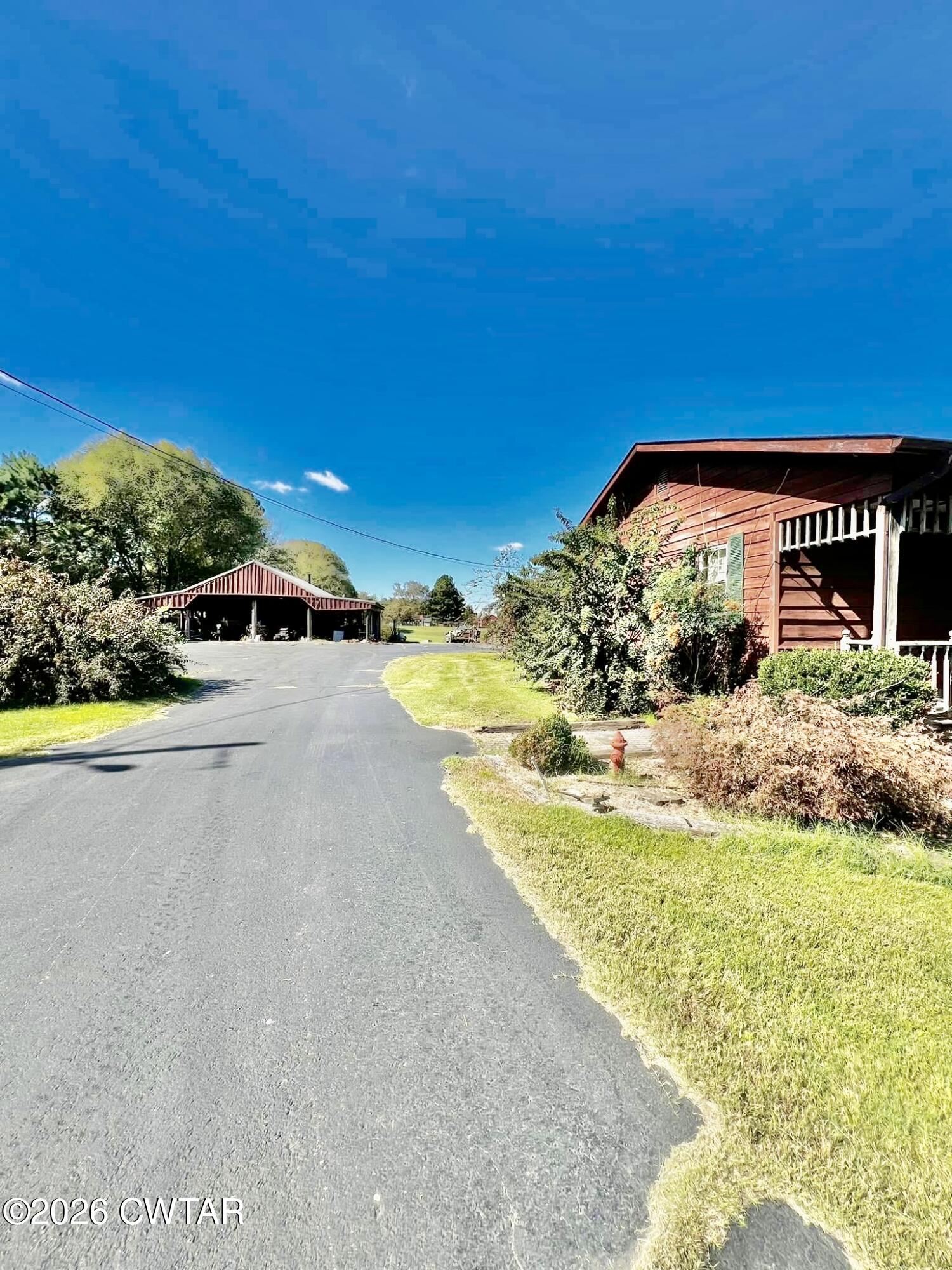 5082 Claude Tucker Road Union City, TN 38261 - Photo 15 of 20 a view of a house with a swimming pool