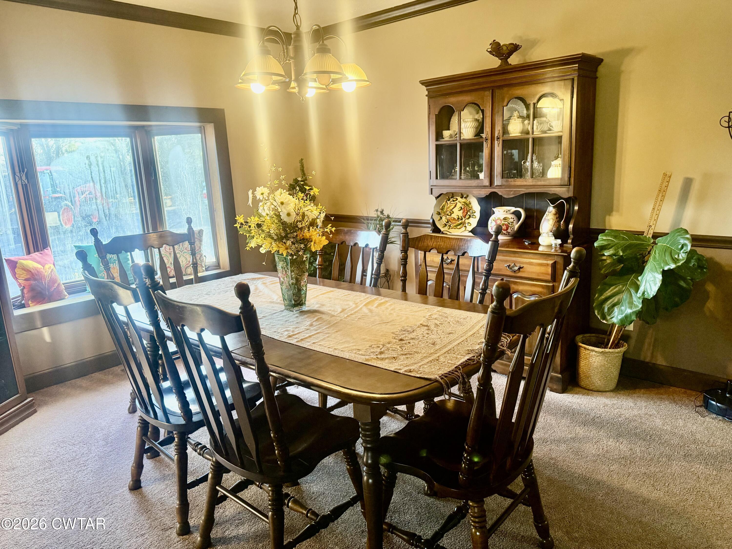 5082 Claude Tucker Road Union City, TN 38261 - Photo 8 of 20 a view of a dining room with furniture and chandelier
