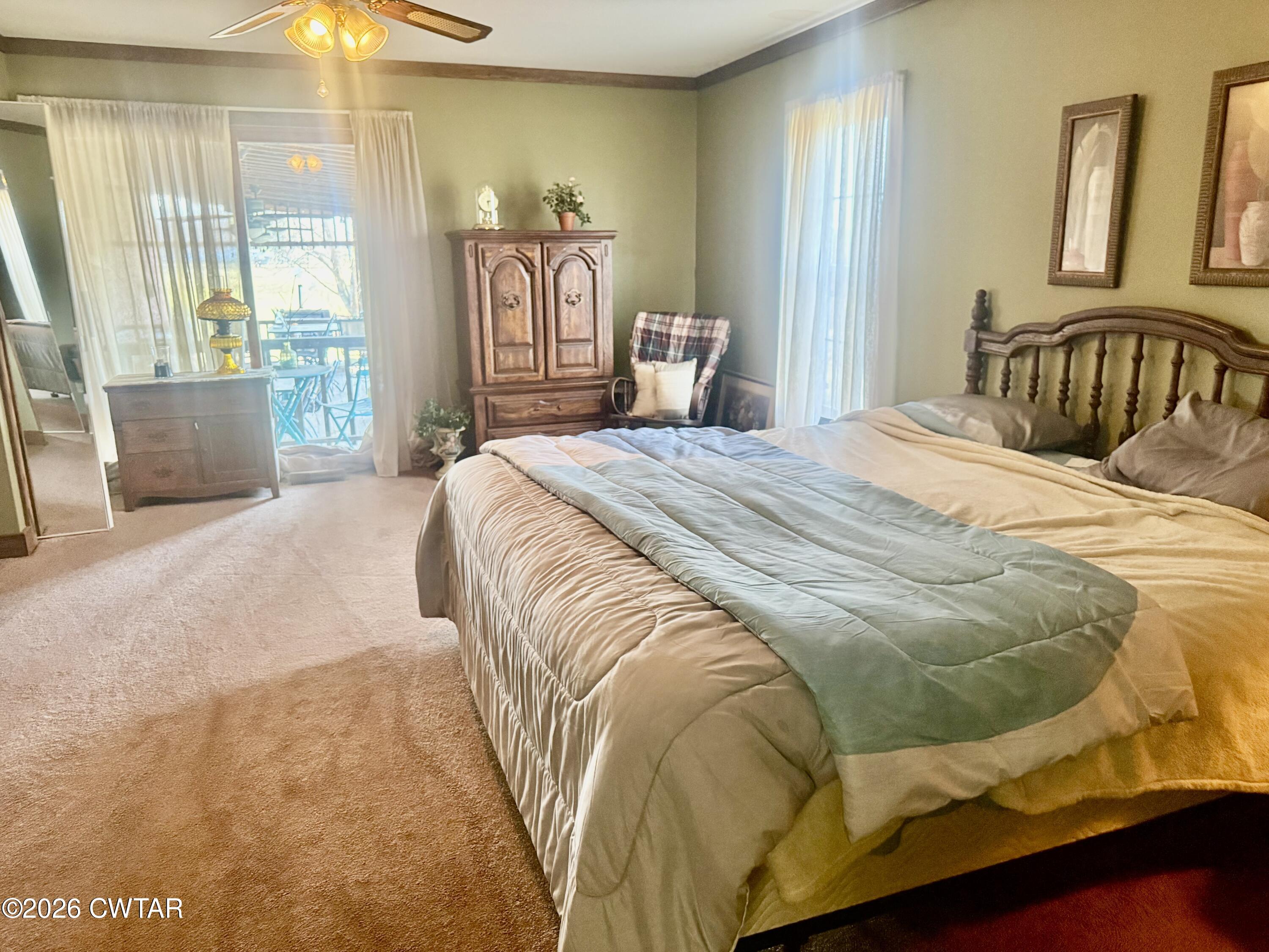 5082 Claude Tucker Road Union City, TN 38261 - Photo 9 of 20 a bedroom with a bed and wooden floor