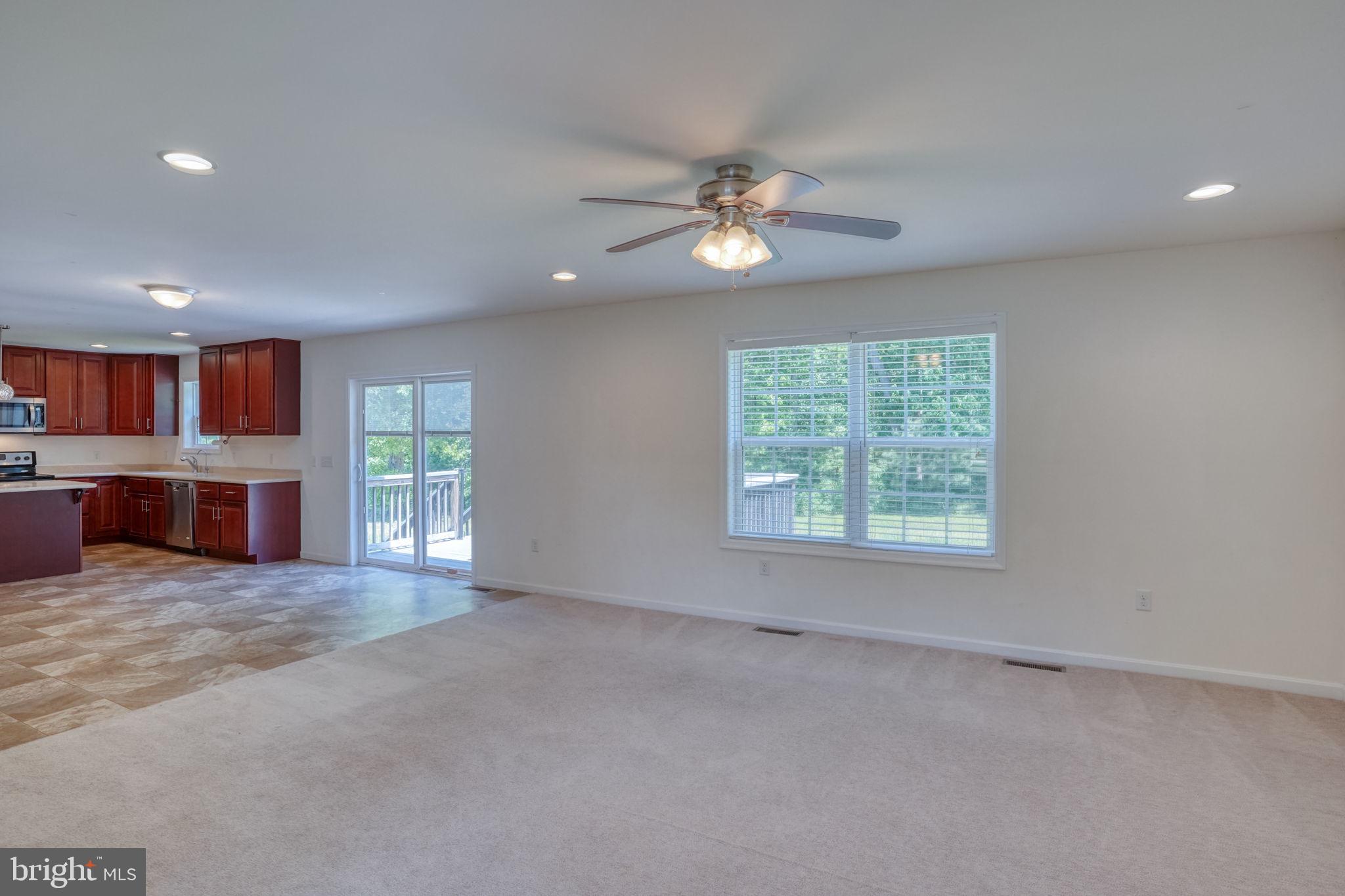 107 Hunters Run Magnolia, DE 19962 - Photo 11 of 41 a view of a livingroom with a ceiling fan and window