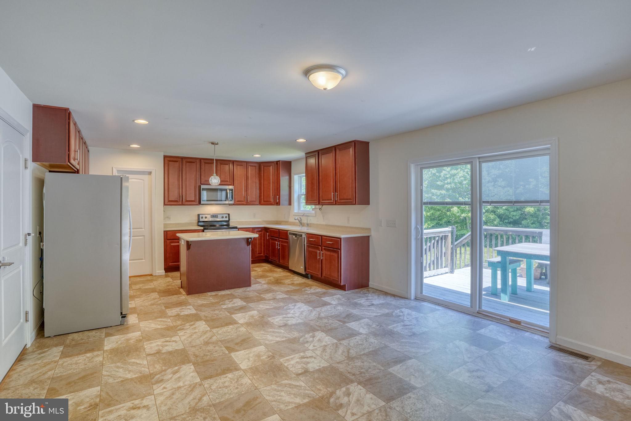 107 Hunters Run Magnolia, DE 19962 - Photo 2 of 41 a large kitchen with a large counter top stainless steel appliances and cabinets