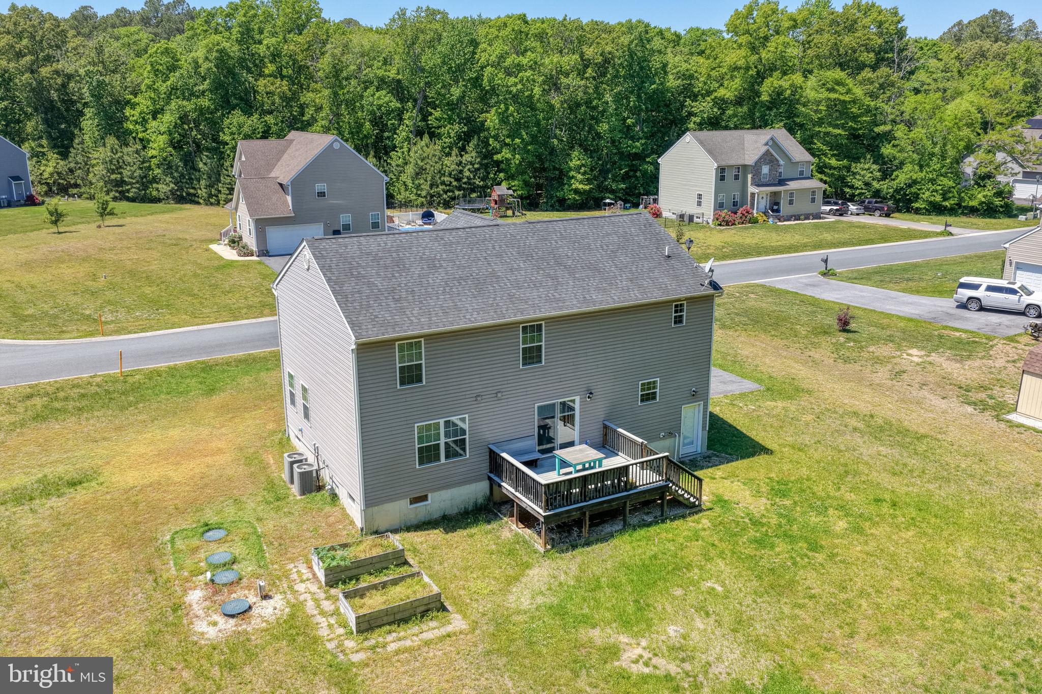 107 Hunters Run Magnolia, DE 19962 - Photo 32 of 41 a aerial view of a house with swimming pool and big yard