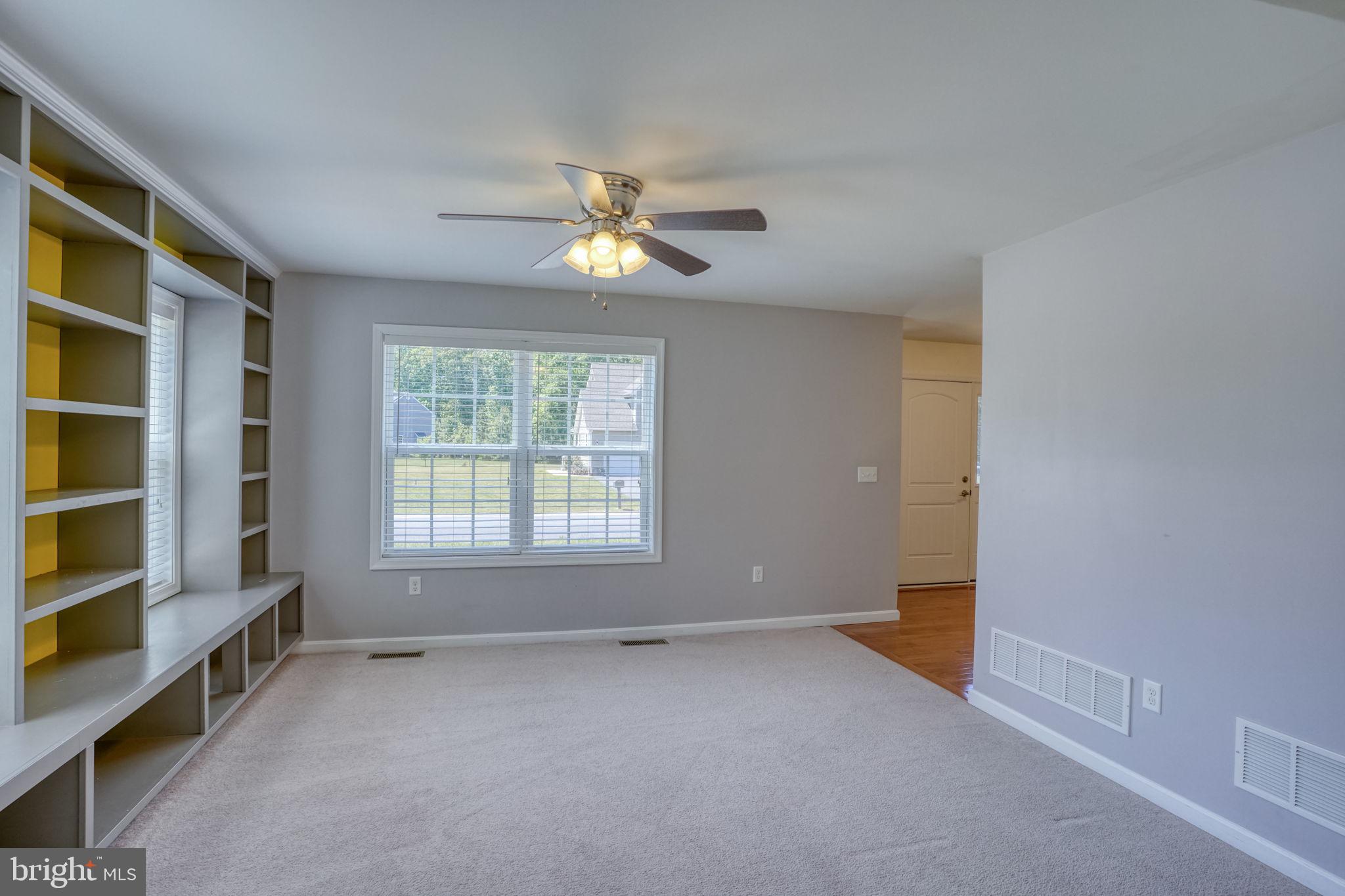 107 Hunters Run Magnolia, DE 19962 - Photo 10 of 41 an empty room with windows and cabinet