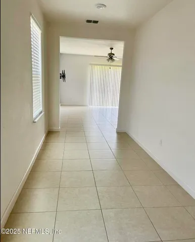 a view of an empty room and window