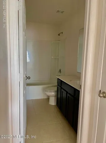 a bathroom with a toilet and a sink