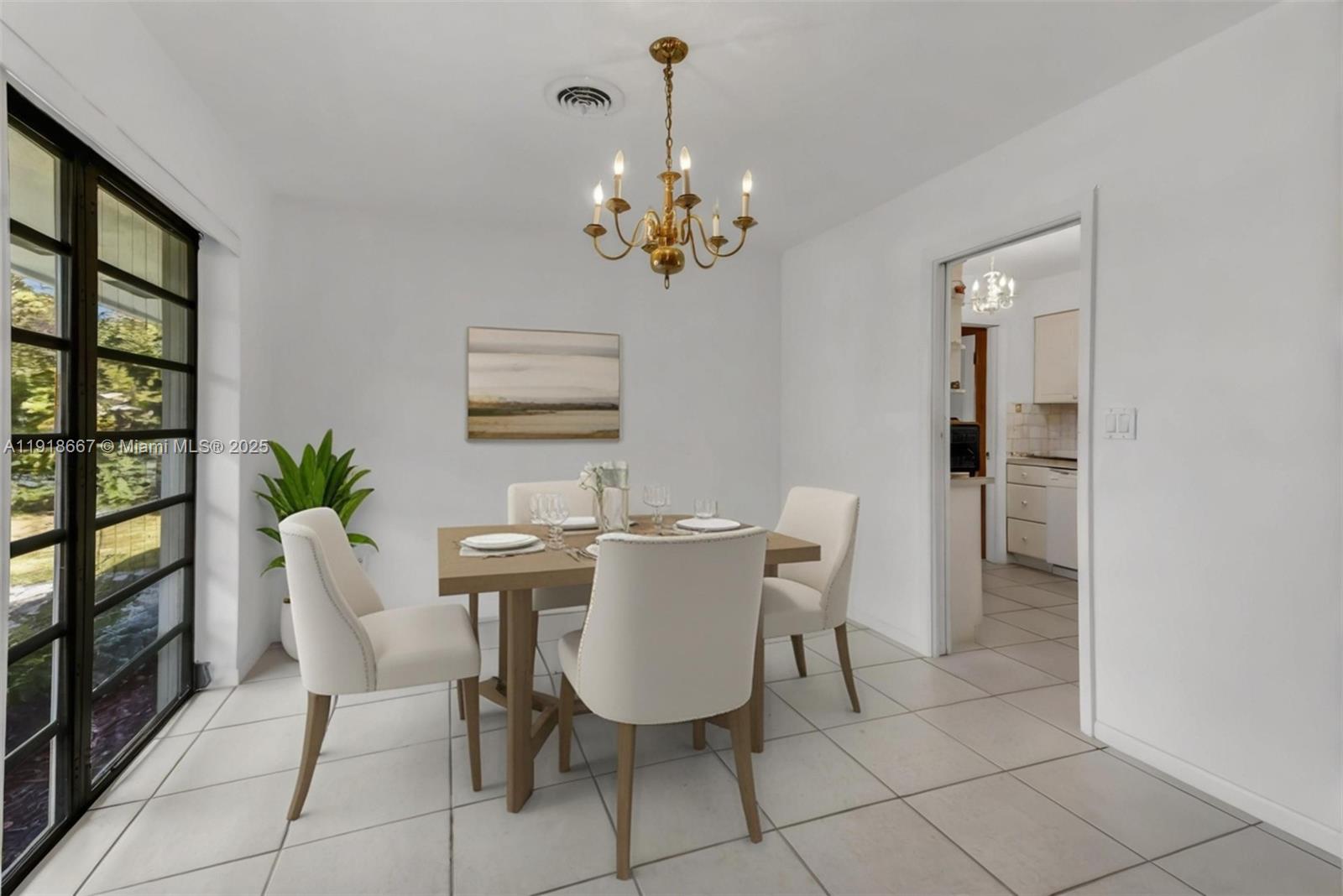 16001 Southwest 98th Avenue Miami, FL 33157 - Photo 4 of 22 a view of a dining room with furniture and chandelier